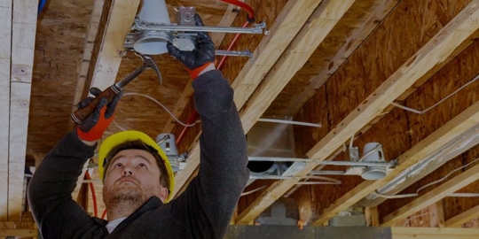 plumber installing linew in new house